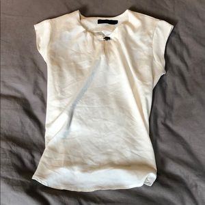Cream cap sleeve shirt